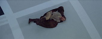 Obi-Wan slides to the edge of the platform