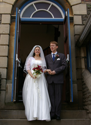Joanne and Nathaniel on the steps outside the Church